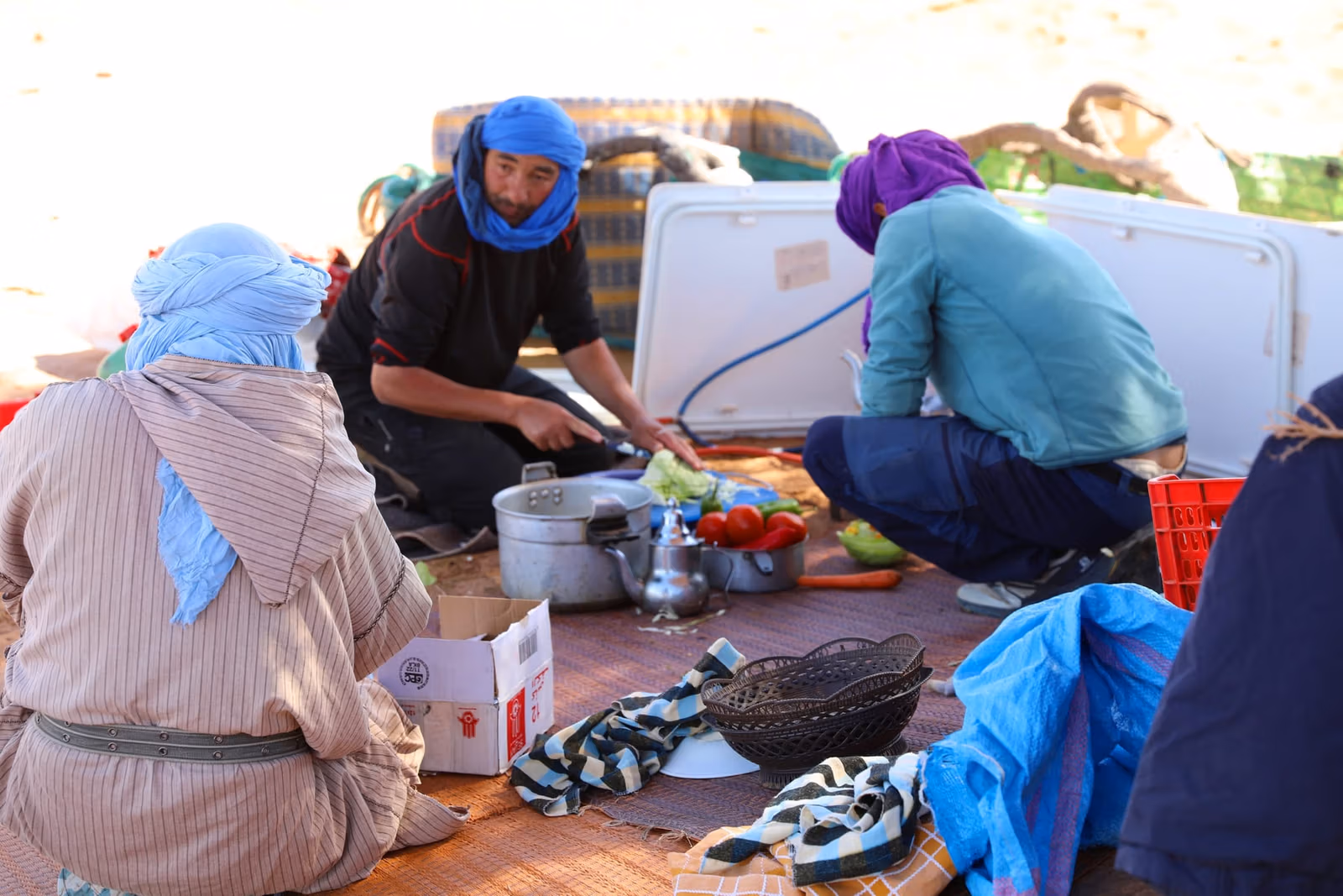 Crew and guests preparing food mat