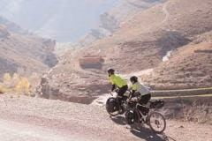 Cyclist dirt track hazy gorge