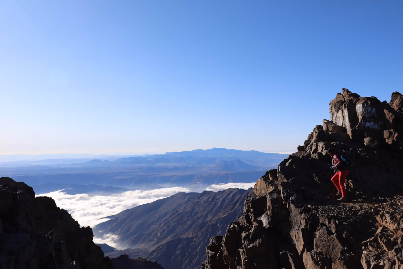 The summit ridge of Mount Toubkal rising above a sea of cloud