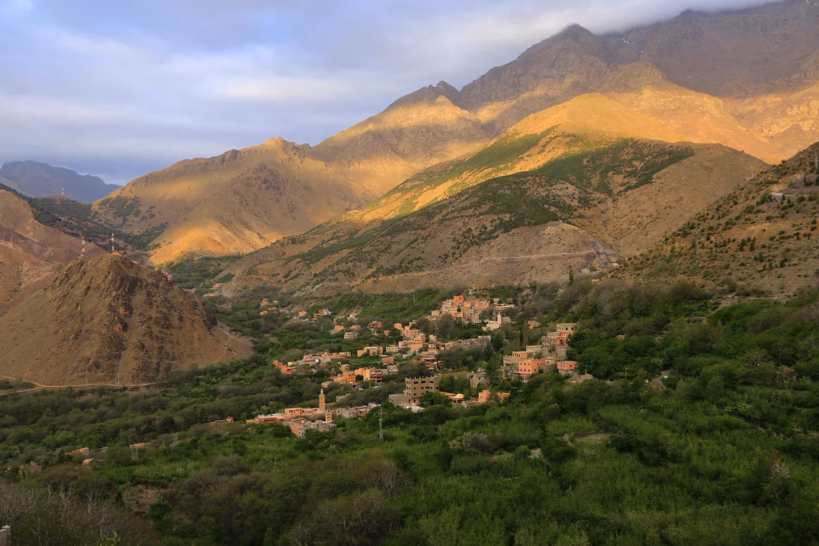Golden evening light over a High Atlas valley and its village